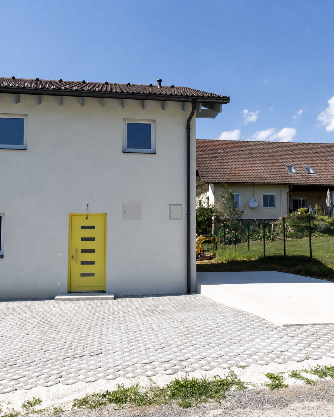 Fassadenvisualisierung Haus 337 mit gelbem Eingang – Darstellung nach Fertigstellung